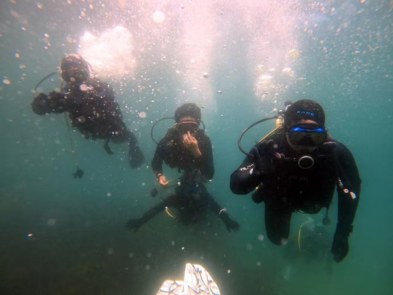 Two divers working together underwater